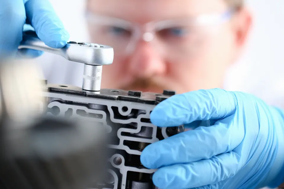 Repair technician working on an automatic transmission