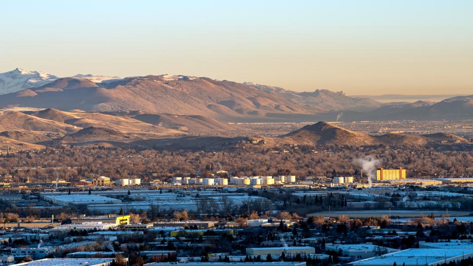 The Sparks industrial area at dusk with the mountains behind
