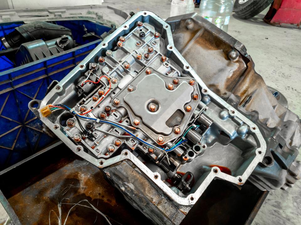 The valve body and solenoids of an automatic transmission, pan removed