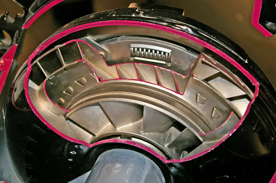 A torque converter cut open to show the turbine blades