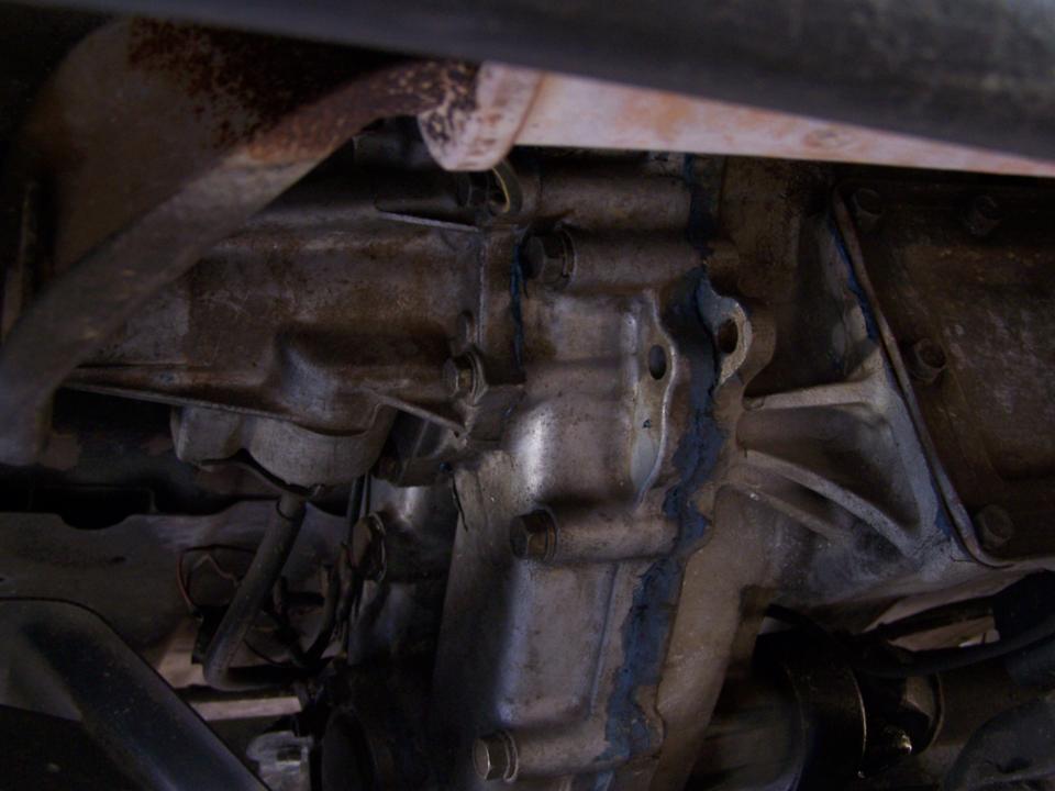 A four-wheel-drive transfer case seen from under a vehicle