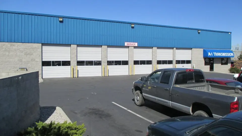 A-1 Transmission building at 670 E Grove St, Reno: blue metal shop with six service bays and the A-1 TRANSMISSION sign